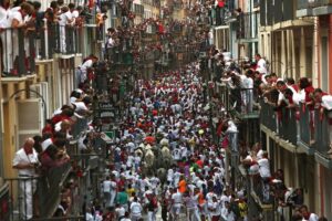 epa05416390 Bulls of the ranch Jose Escolar Gil run through the Mercaderes bend at the Festival of San Fermin 2016 in Pamplona, Spain, 09 July 2016. The festival, locally known as Sanfermines, is held annually from 06 to 14 July in commemoration of the city's patron saint. Hundreds of thousands of visitors from all over the world attend the fiesta. Many of them physically participate in the highlight event - the running of the bulls, or encierro - where they attempt to outrun the bulls along a route through the narrow streets of the old city.  EPA/JAVIER LIZON